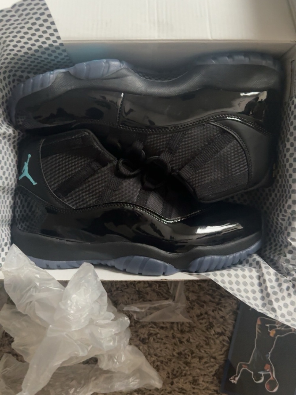 Jordan Retro 11 Shoes in Black with Ice Blue Jumpman